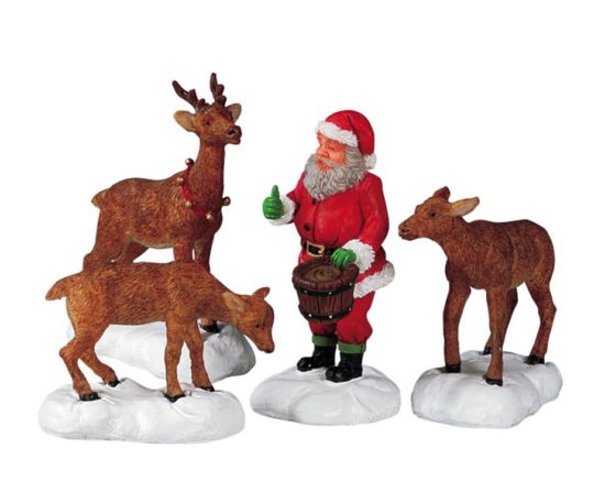 Santa feeds reindeer